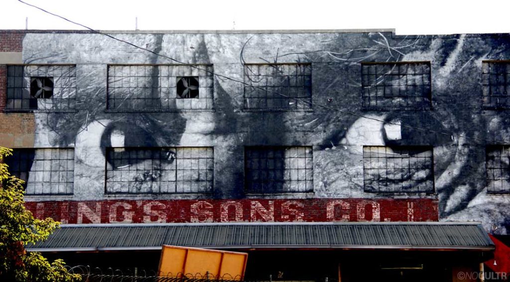 This photograph of eyes on the side of the Angel City Brewery is one of 14 paper and paste installations around Los Angeles as part of an international project called 